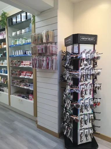 Reading glasses stand next to skincare shelves